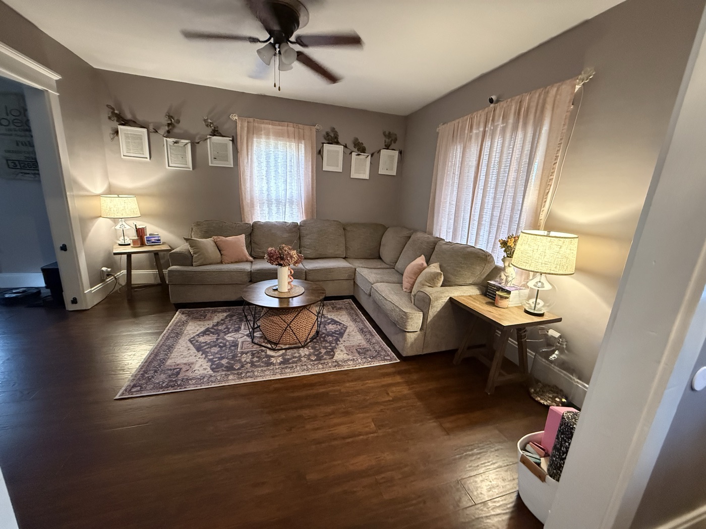 Cozy living room with a gray sectional and hardwood floors
